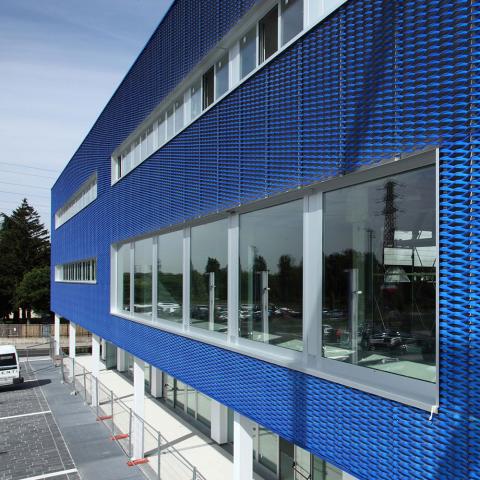 Exapnded metal façade coated in blue colour